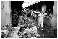Vegetables for sale in an alley of the Ben Than Market. Ho Chi Minh City, Vietnam ( black and white)