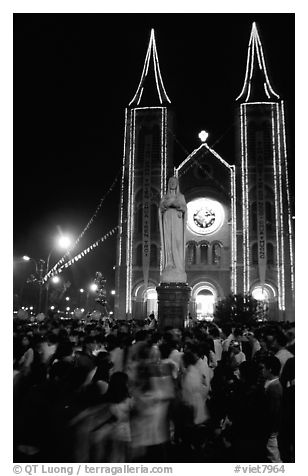 Crowds gather at the Cathedral St Joseph for Christmans. Ho Chi Minh City, Vietnam (black and white)