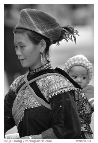 Young Flower Hmong woman and baby. Bac Ha, Vietnam