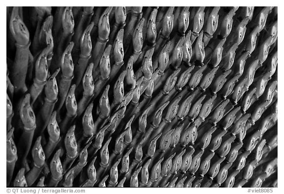 Detail of the thousands hands of a Buddha statue. Ha Tien, Vietnam (black and white)