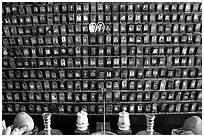 Pictures of the deceased for veneration on altar. Ho Chi Minh City, Vietnam (black and white)