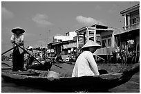 River at the back of townhouses, more used than the road at the front, Phung Hiep. Can Tho, Vietnam (black and white)