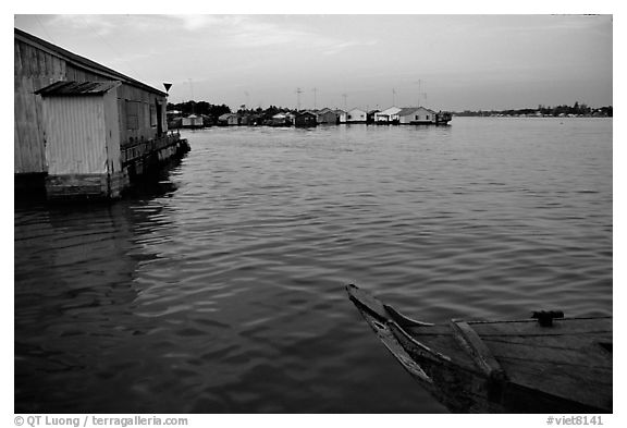 Floating houses. They double as fish reservoirs. Chau Doc, Vietnam (black and white)
