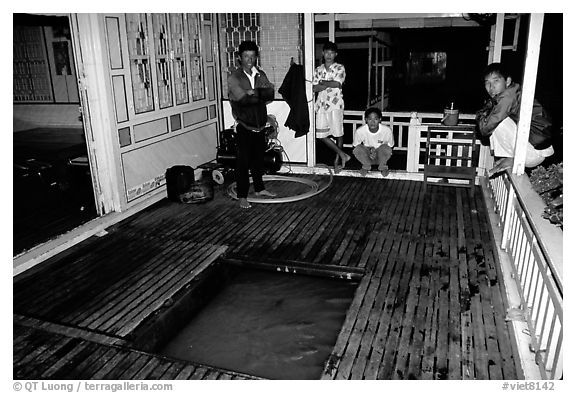 Fish are hatched underneath the house. Chau Doc, Vietnam (black and white)