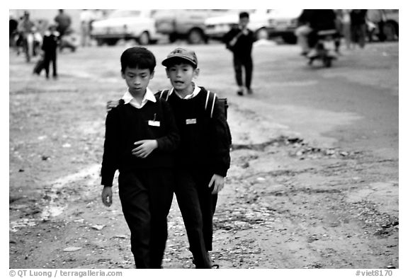 School children wear French-style chic sweaters. Da Lat, Vietnam (black and white)