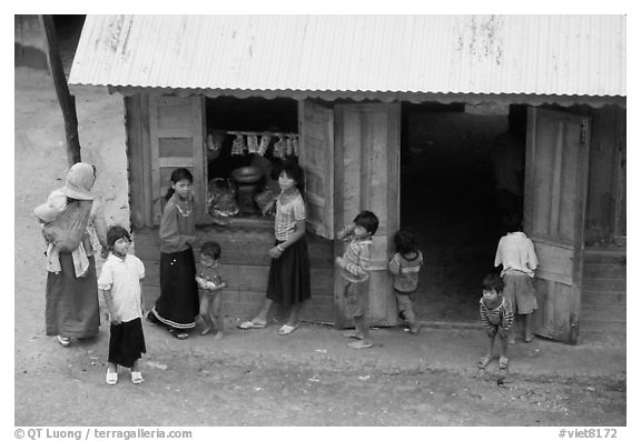 Gathering at the village store, in a minority village. Da Lat, Vietnam (black and white)
