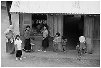 Gathering at the village store, in a minority village. Da Lat, Vietnam (black and white)