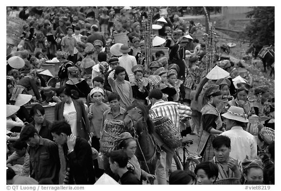 Colorful crowd at the sunday market, where people from the surrounding hamlets gather weekly to meet, shop and eat. Bac Ha, Vietnam (black and white)