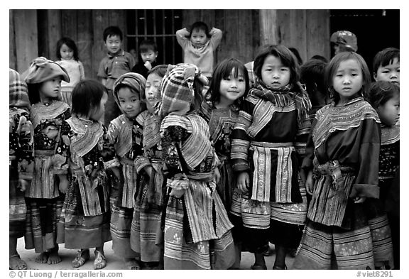 black and white kids photos. School kids in colorfull everyday dress. Bac Ha, Vietnam (black and white)