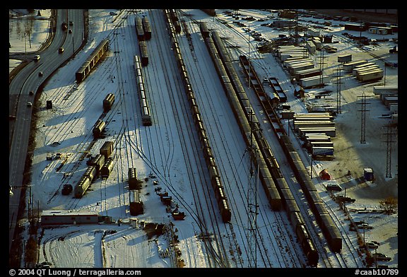 Rail tracks and cargo cars in winter. Calgary, Alberta, Canada