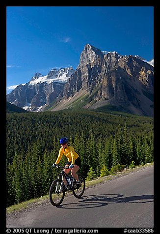 Cyclist on the road to the Valley of Ten Peaks. Banff National Park, Canadian Rockies, Alberta, Canada