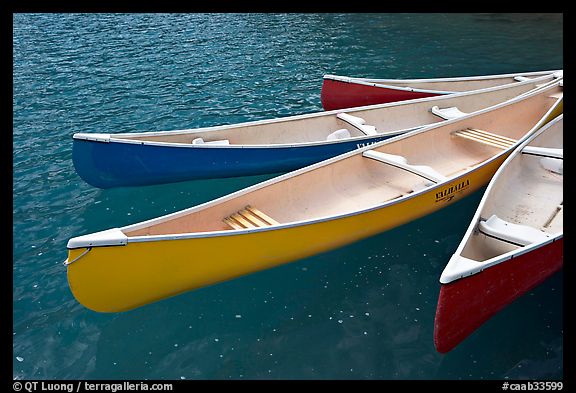 Close up of brightly colored canoes, Moraine Lake. Banff National Park, Canadian Rockies, Alberta, Canada (color)