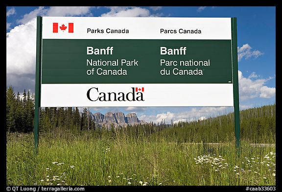 Bilingual sign at the entrance of the Park. Banff National Park, Canadian Rockies, Alberta, Canada (color)