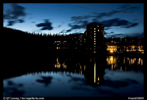 Chateau Lake Louise Hotel reflected in Lake at night. Banff National Park, Canadian Rockies, Alberta, Canada