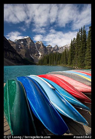 Colorful canoes stacked on the boat dock, Lake Moraine, morning. Banff National Park, Canadian Rockies, Alberta, Canada (color)