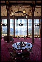 Table in lobby of Prince of Wales hotel with view over Waterton Lake. Waterton Lakes National Park, Alberta, Canada (color)