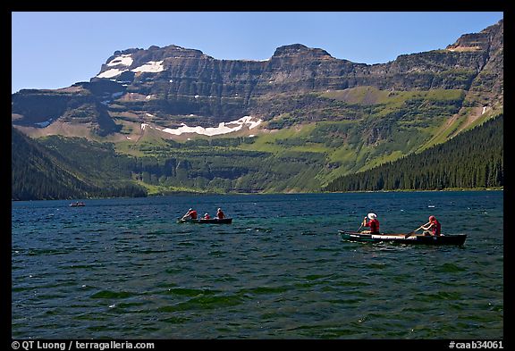 Canoists on Cameron Lake. Waterton Lakes National Park, Alberta, Canada