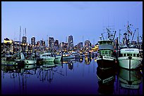 Fishing boats and skyline at dusk. Vancouver, British Columbia, Canada (color)