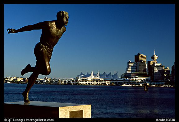 Runner's statue and Harbor center, late afernoon. Vancouver, British Columbia, Canada (color)