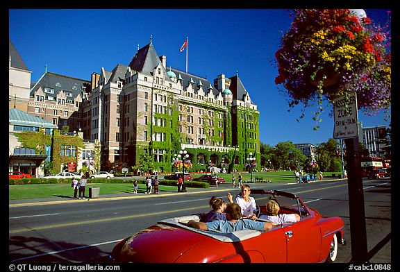 Red convertible car and Empress hotel. Victoria, British Columbia, Canada (color)