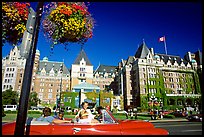 Red convertible car and Empress hotel. Victoria, British Columbia, Canada
