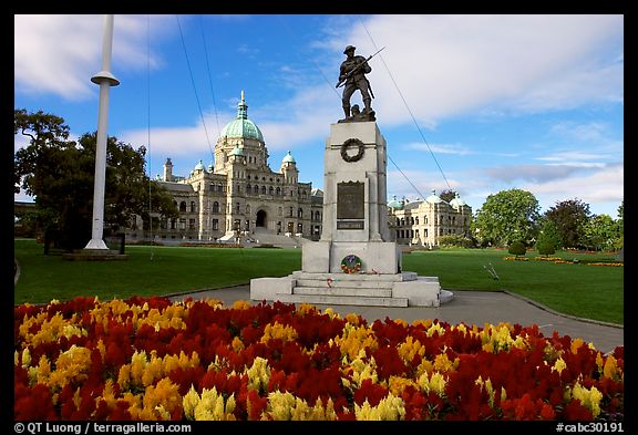Flowers, memorial, and parliament building. Victoria, British Columbia, Canada (color)
