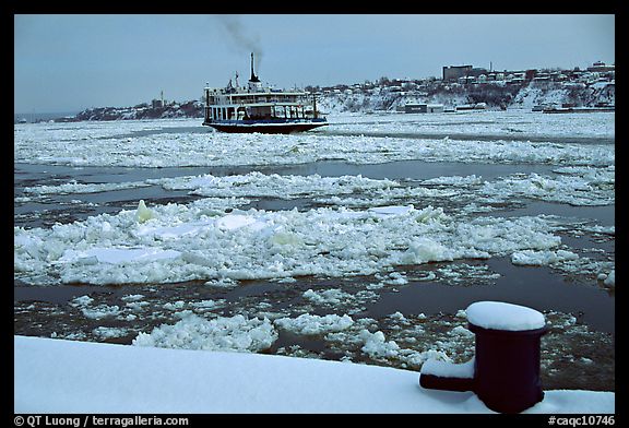 Ferry crossing the Saint Laurent river partly covered with ice, Quebec City. Quebec, Canada (color)
