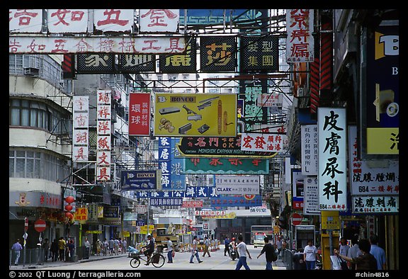 Street in Kowloon with signs in Chinese. Hong-Kong, China