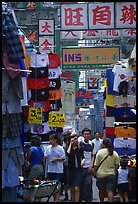 Crowded alley with clothing vendors, Kowloon. Hong-Kong, China