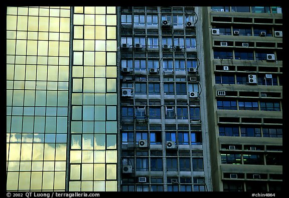 Glass building next to older buildings with air conditioners, Hong-Kong Island. Hong-Kong, China (color)