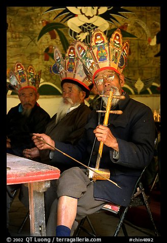 Elderly musician Playing the traditional two-stringed Ehru. Baisha, Yunnan, China