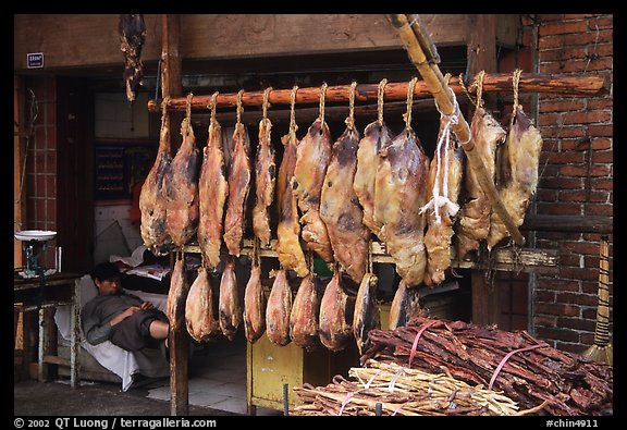 Ham made with cattle legs, salted when raw, and dried under the sun. Kunming, Yunnan, China (color)