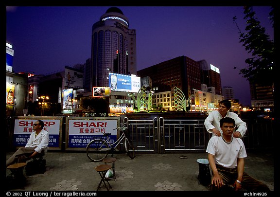 Public massage on the traffic square at  the intersection of Zhengyi Lu and Dongfeng Lu. Kunming, Yunnan, China (color)