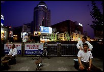 Public massage on the traffic square at  the intersection of Zhengyi Lu and Dongfeng Lu. Kunming, Yunnan, China