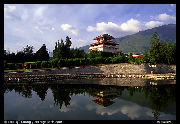 Chong-sheng Si, temple behind the Three Pagodas, reflected in a pond. Dali, Yunnan, China (color)