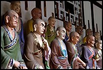 A variety of postures and expressions of some of the 1000 Terracotta arhat monks in Luohan Hall. Leshan, Sichuan, China (color)