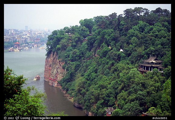 Cliffs of Lingyun Hill with the city in the background. Leshan, Sichuan, China