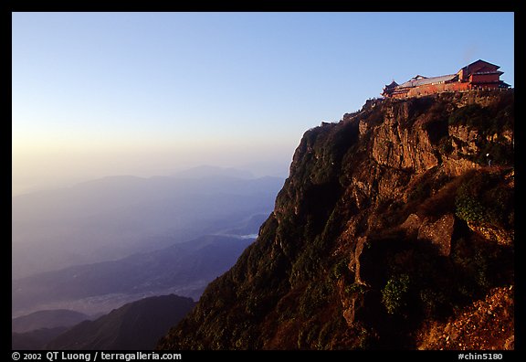 Jinding Si temple perched on a precipituous cliff at sunrise. Emei Shan, Sichuan, China