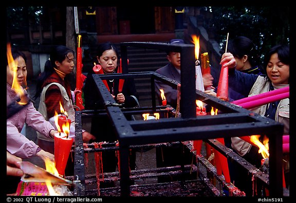 Pilgrims burning big incense batons. Emei Shan, Sichuan, China