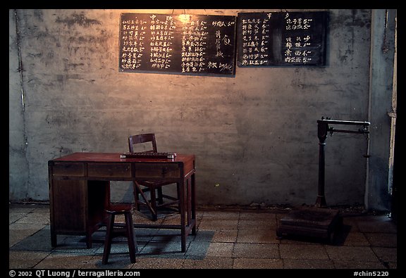 Desk with counting frame, blackboard with Chinese script, scale. Emei Shan, Sichuan, China
