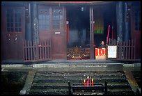 Monk looks to the courtyard inside Xixiangchi temple. Emei Shan, Sichuan, China (color)