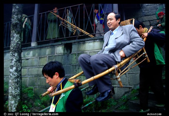 Wealthy pilgrim carried down Jieyin Palace on a chair. Emei Shan, Sichuan, China