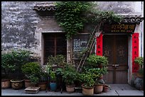 Facade with potted plants. Hongcun Village, Anhui, China