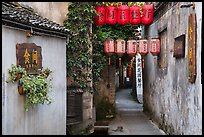 Alley with lanterns and plants. Hongcun Village, Anhui, China