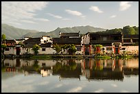 Village reflected in Nanhu Lake, morning. Hongcun Village, Anhui, China