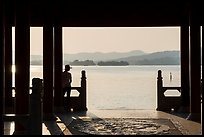 Man in Cuiguang Pavilion and West Lake. Hangzhou, China ( color)
