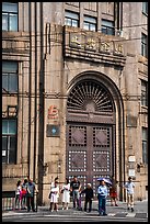 People standing in front of historic bank gate. Shanghai, China ( color)