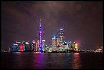 Shanghai skyline with Oriental Perl Tower and Huangpu River at night. Shanghai, China ( color)