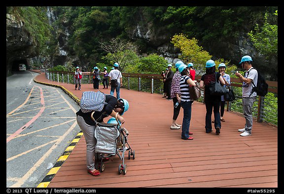 Tourists wearing park-provided helmets for safety. Taroko National Park, Taiwan