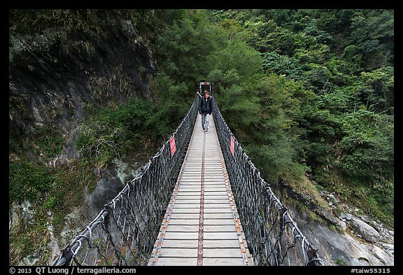 Hiker on suspension footbridge, Taroko Gorge. Taroko National Park, Taiwan